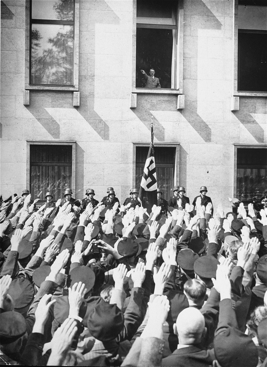On the day of his appointment as German chancellor, Adolf Hitler greets a crowd of enthusiastic Germans from a window in the Chancellery building.