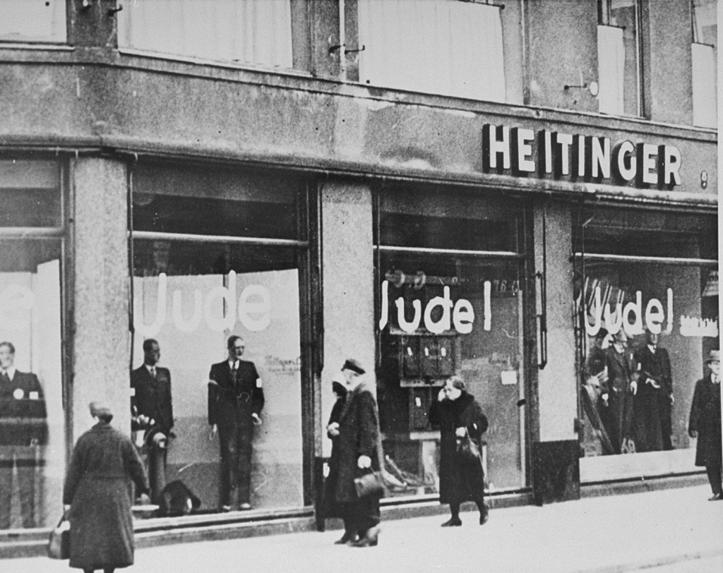 Windows of a Jewish-owned store painted with the word "Jude" (Jew). [LCID: 69163b]