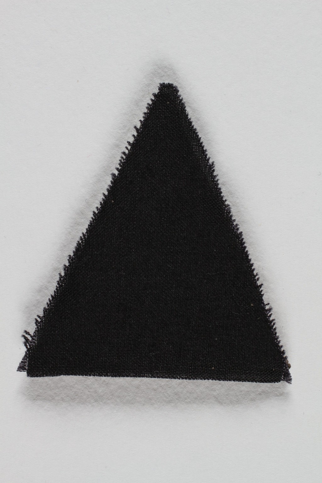Unused black triangle concentration camp badge