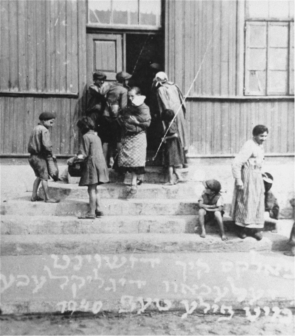 Women and children at the door of a soup kitchen maintained by the American Jewish Joint Distribution Committee. [LCID: 49020]