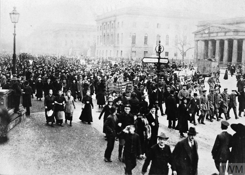 A public demonstration is held on the Unter den Linden in Berlin on November 9, 1918. On this day, Kaiser Wilhelm II abdicated the throne after a recent naval mutiny in Kiel inspired widespread revolution. © IWM Q 88164