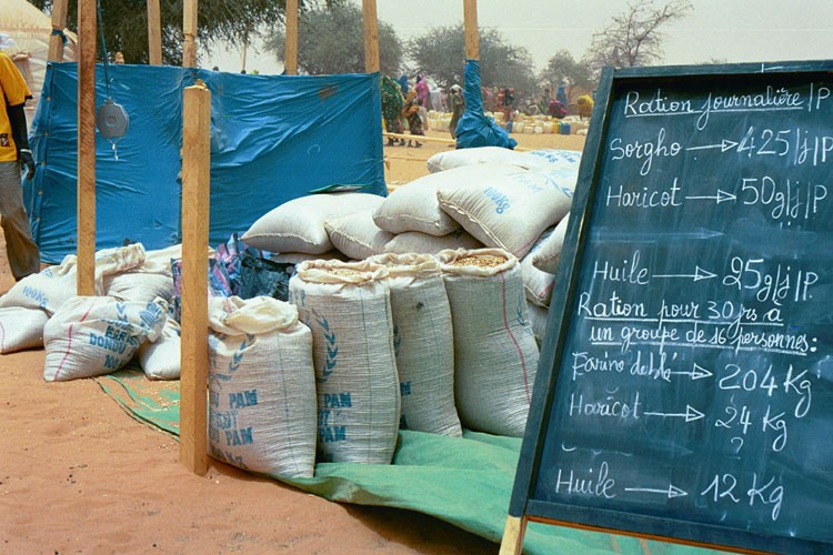 <p>Relief supplies in a refugee camp in eastern Chad for refugees from the Darfur region of neighboring Sudan. Jerry Fowler, Staff Director of the Museum's Committee on Conscience, visited in May 2004 to hear firsthand the refugees' accounts of the genocidal violence they faced and of being driven into the desert.</p>