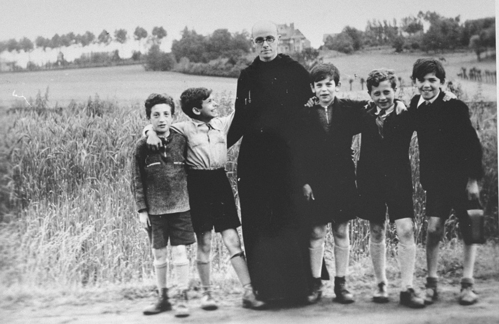 Father Bruno with Jewish children he hid from the Germans. [LCID: 08732]