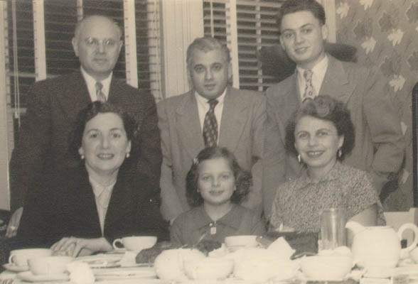 Thomas (standing, right), then known as "Tommy," with relatives shortly after arriving in the United States.