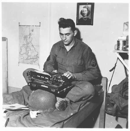 US Army Signal Corps photographer J Malan Heslop types photo captions.