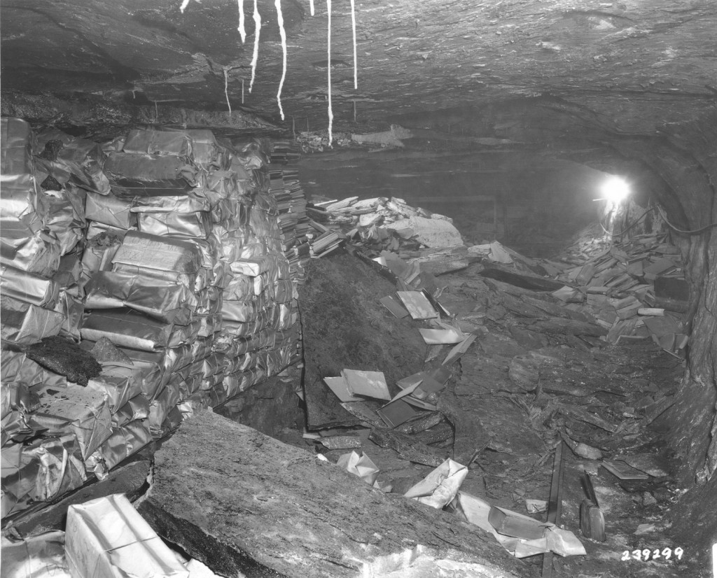 Einsatzstab Rosenberg looted  materials of Jewish culture like these books found stacked in the cellar of the Nazi Institute for ...