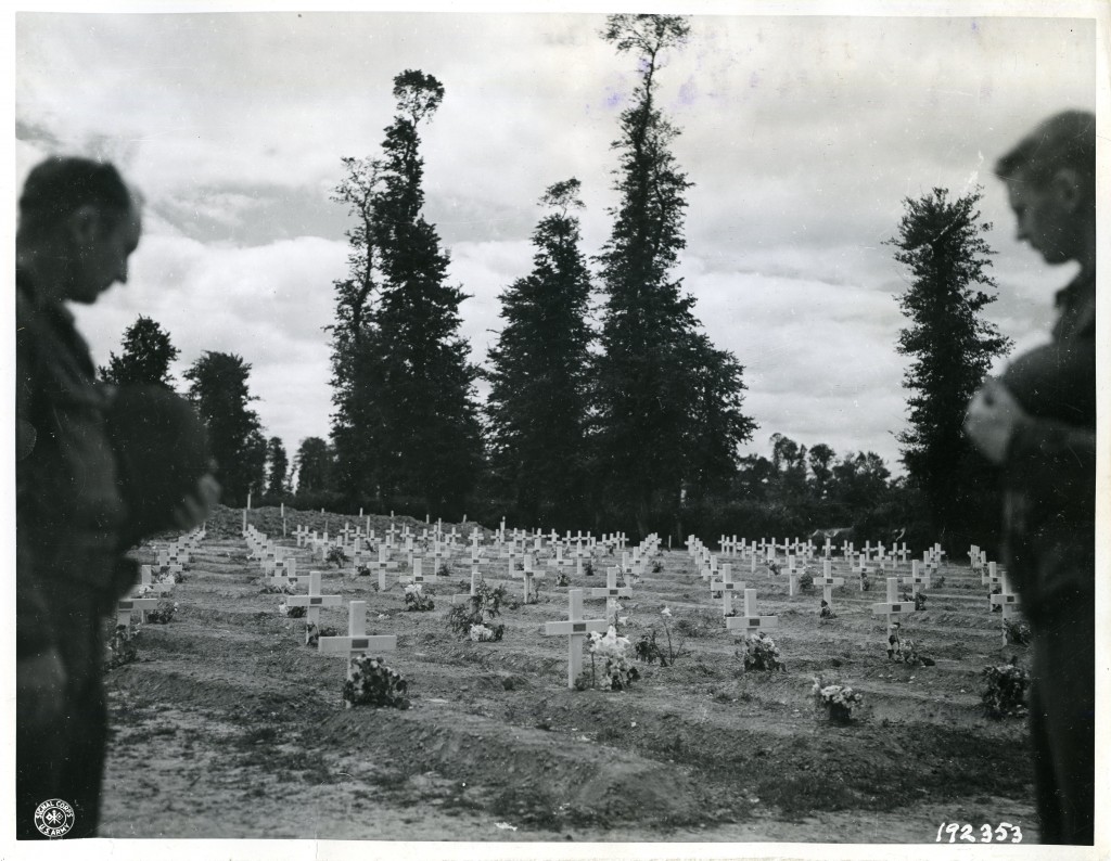 Members of the US Army 29th Infantry Division at a gravesite in Normandy, France, 1944