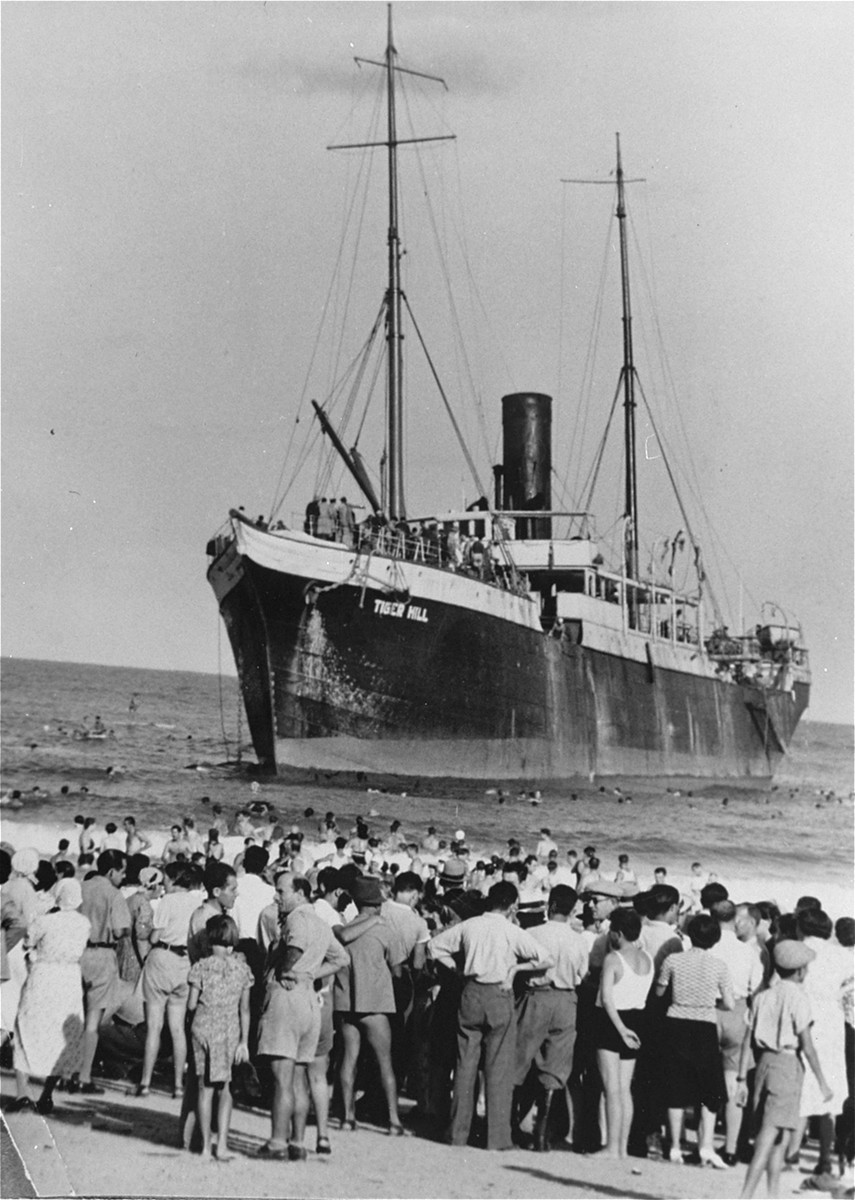 Aliyah Bet ("illegal" immigration) ship "Tiger Hill," carrying Jewish refugees from Europe, lands in Tel Aviv, Palestine. [LCID: 69440]