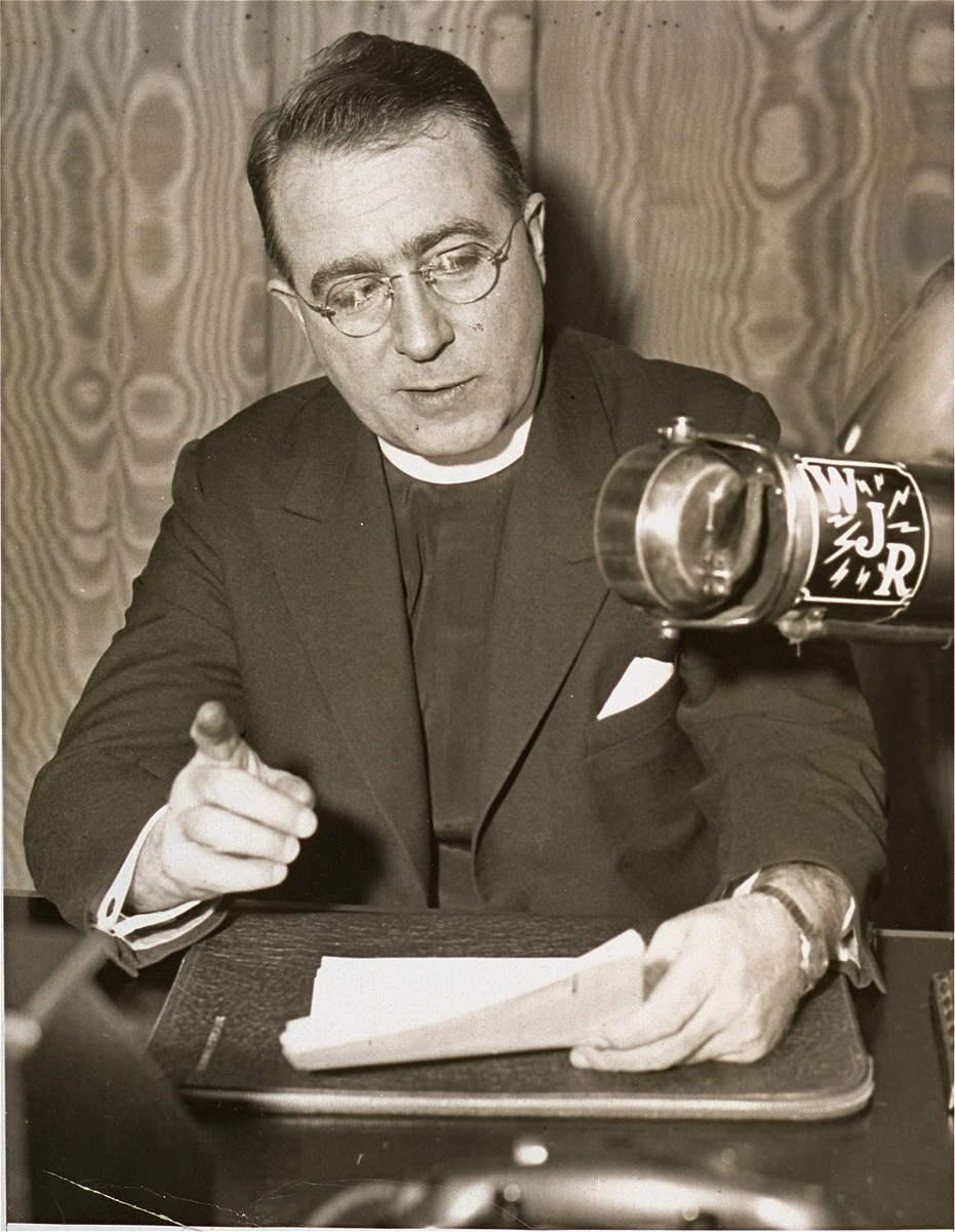 Father Charles Coughlin, leader of the antisemitic Christian Front, delivers a radio broadcast.