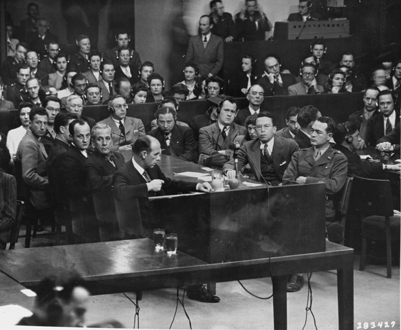 The prosecution team on the day the court announced its findings at the Milch Trial. Seated at the right is US Brigadier General Telford Taylor, chief of counsel. Across from him sits Clark Denny, chief trial counsel. April 16, 1947.