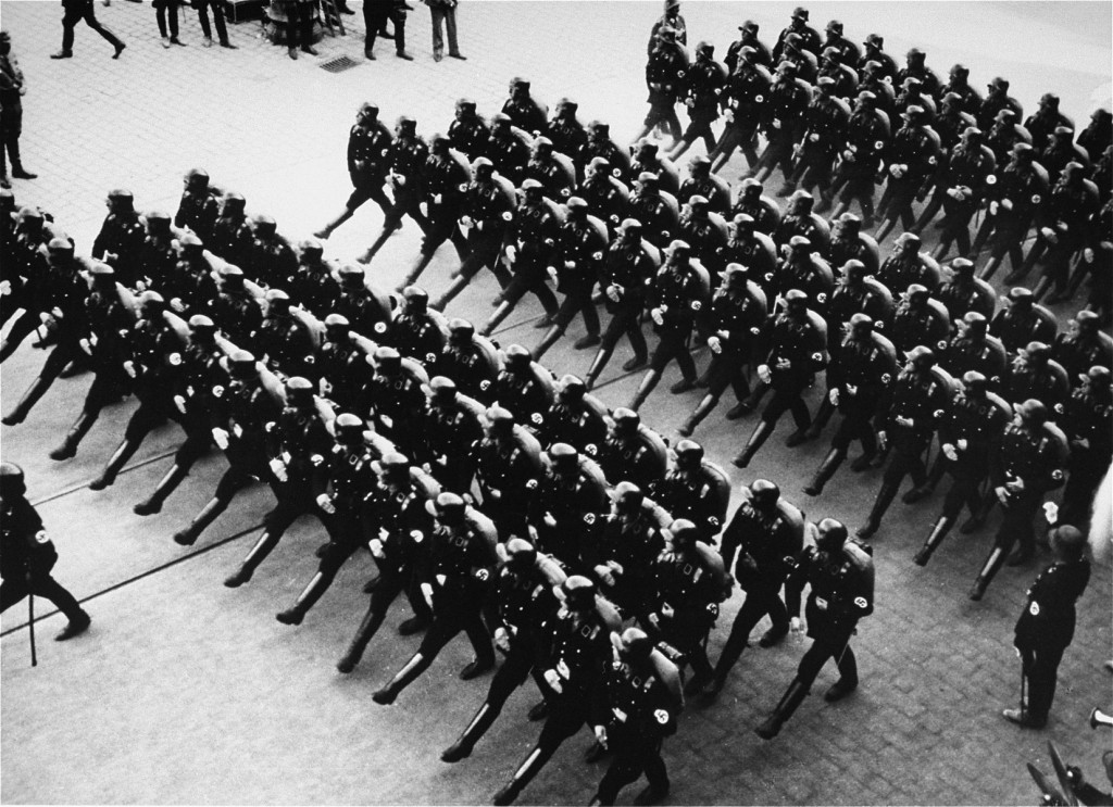 Members of the SS (Schutzstaffel; originally Hitler's bodyguard, later the elite guard of the Nazi state) parade during a rally.