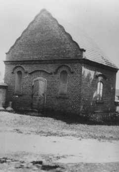 Postwar photograph of a building in Dabie where the possessions of Jews killed at the nearby Chelmno camp were stored. [LCID: 51702]