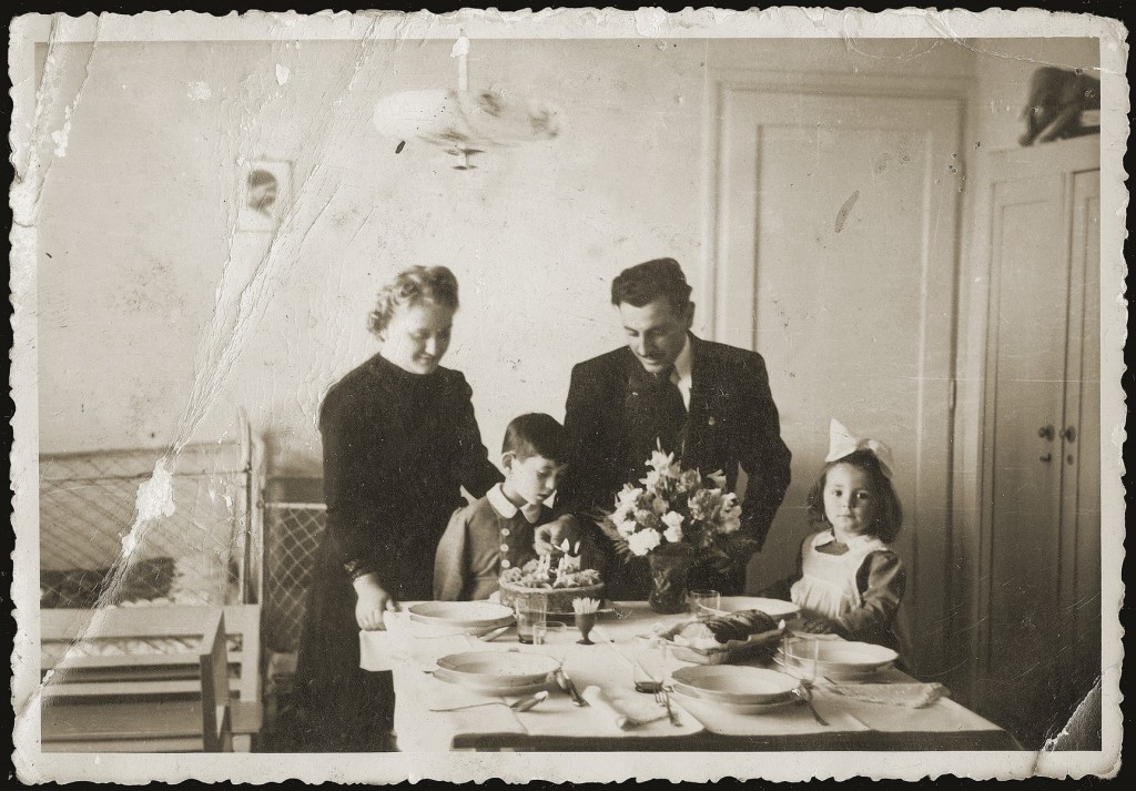 Gavra Mandil celebrates his fourth birthday with his parents, Mosa and Gabriela, and sister Irena. [LCID: 08211]