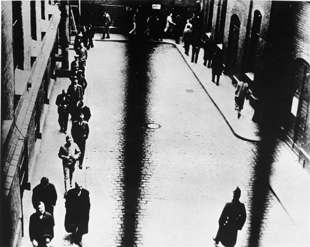 Prisoners arrested during the crackdown on leftists and other targeted groups exercise in the courtyard of the Alexanderplatz prison.