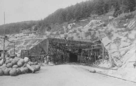 View of a tunnel entrance to the rocket factory at the Dora-Mittelbau concentration camp, near Nordhausen. [LCID: 01277]