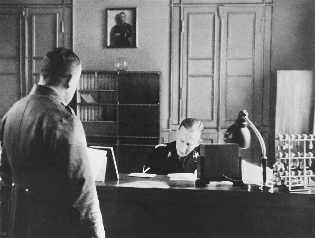 SS General Reinhard Heydrich in his office during his tenure as Bavarian police chief.