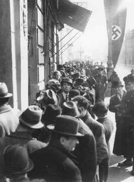 Jews wait in front of the Polish Embassy for entrance visas to Poland after Germany's annexation of Austria. [LCID: 65615]