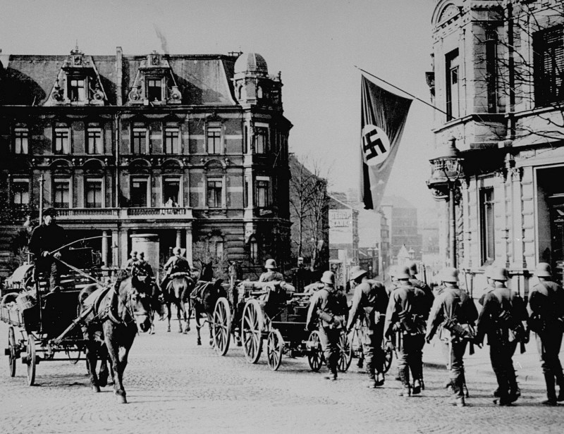 German forces enter Aachen, on the border with Belgium, following the remilitarization of the Rhineland.