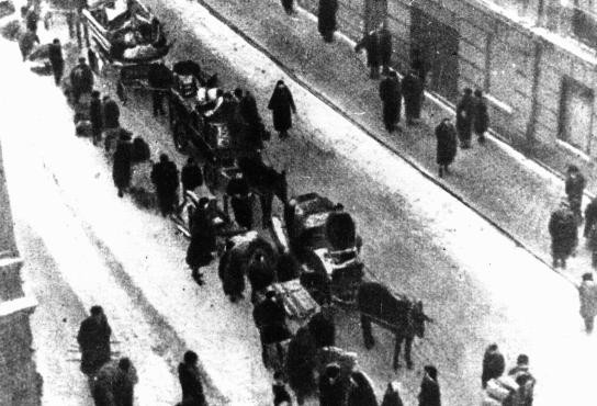 Jews forced to move into the Lodz ghetto. Lodz, Poland, date uncertain. [LCID: 50345]