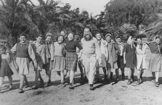 <p>A group of Polish Jewish children (known as the "<a href="/narrative/11006">Tehran Children</a>"), who arrived in Palestine via Iran, at the Mikveh Israel agricultural village. Palestine, February or March 1943.</p>