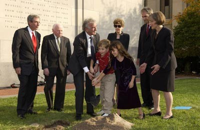 Benjamin Meed, Elie Wiesel (second and third from left), and two children bury a time capsule during the Tribute to Holocaust Survivors: Reunion of a Special Family, one of the Museum's tenth anniversary events.