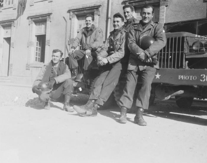 Group portrait of members of Combat Unit 123, a unit of the U.S. Army 167th Signal Photo Company: Walt MacDonald, Arnold Samuelson, J Malan Heslop, John O'Brien, and Eddie Urban.