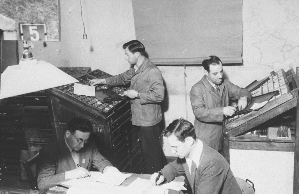 Jewish refugees work on a newspaper at Zeilsheim displaced persons camp. [LCID: 89559]
