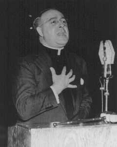 Father Charles Coughlin, leader of the antisemitic Christian Front, delivers a radio broadcast. [LCID: 90522]