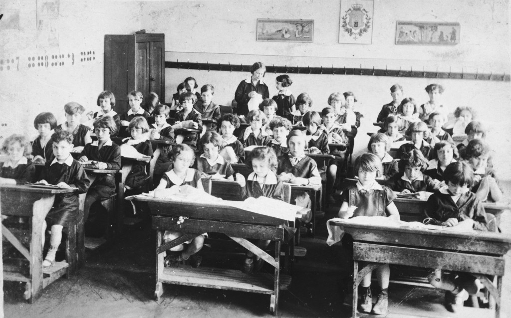 Pupils sit at their desks in a classroom at a public school on Zamarstynowska Street in Lviv