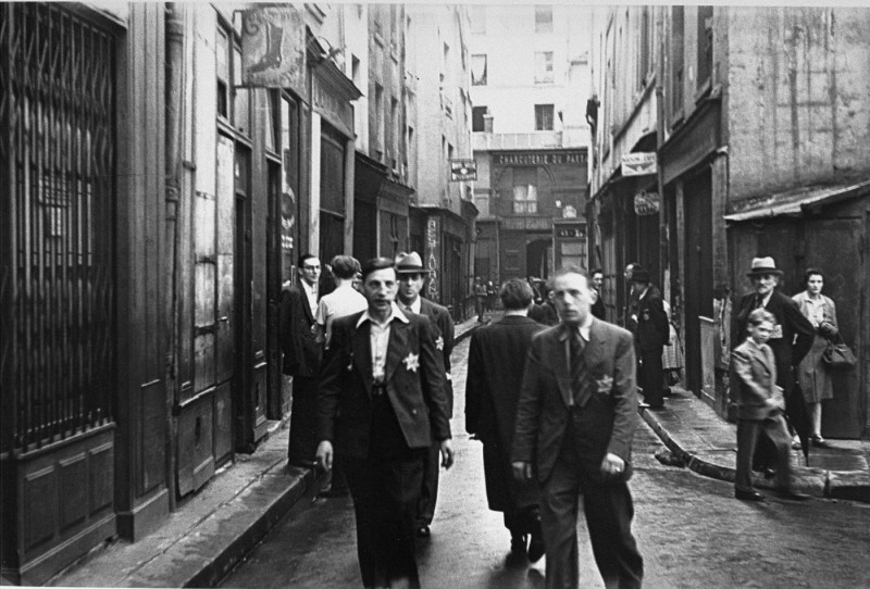 Jewish men wearing the mandatory yellow badge in the Jewish quarter of Paris.