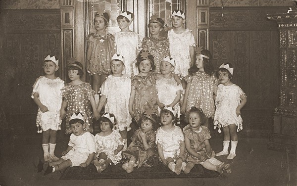 Group portrait of children dressed in Purim costumes.
