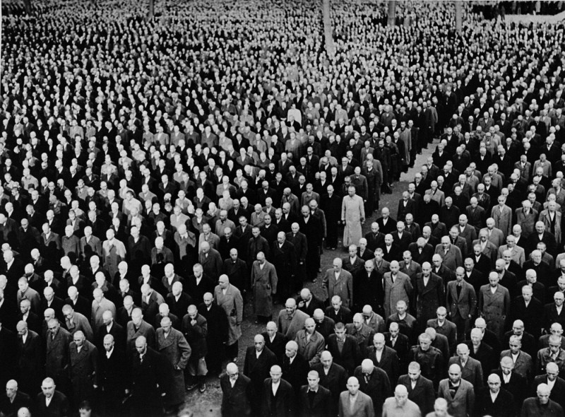 Roll call for newly arrived prisoners, mostly Jews arrested during Kristallnacht (the "Night of Broken Glass" pogrom), at the Buchenwald concentration camp. Buchenwald, Germany, 1938.