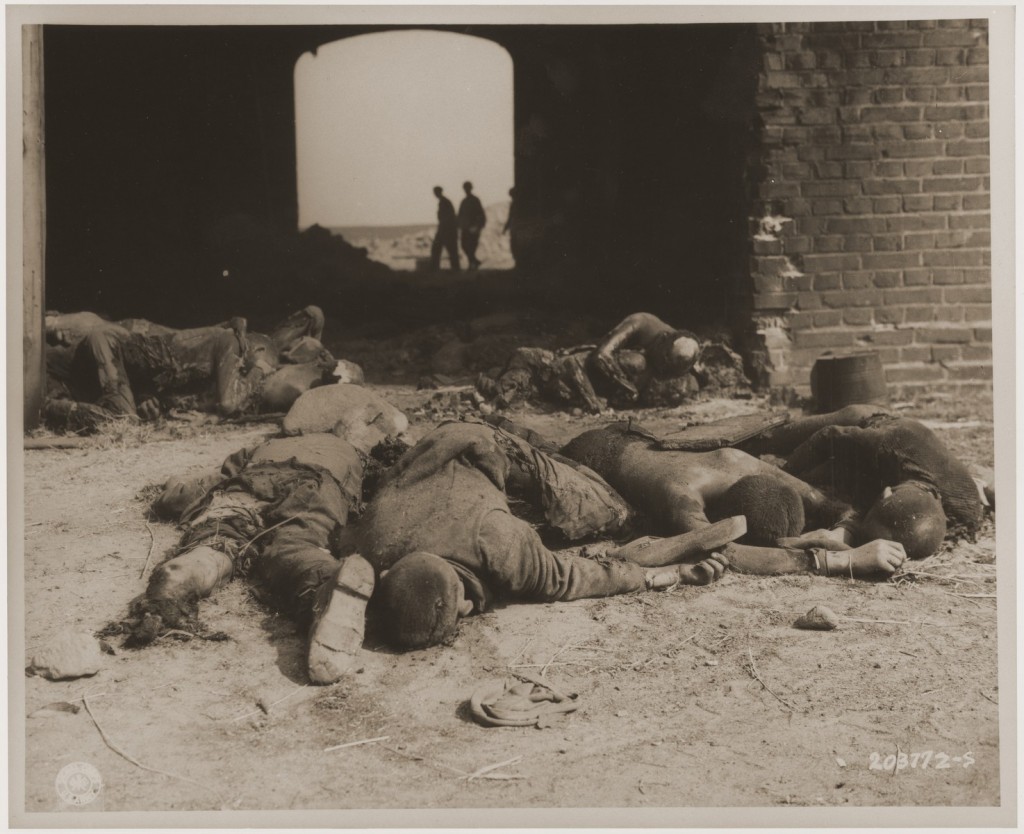 Burned bodies of former prisoners of Rottleberode, a subcamp of Dora-Mittelbau, lie near the entrance to a barn that had been set ... [LCID: 66162]