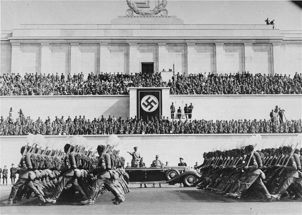 Reich Labor Service battalions parade before Hitler during the Nazi Party Congress.
