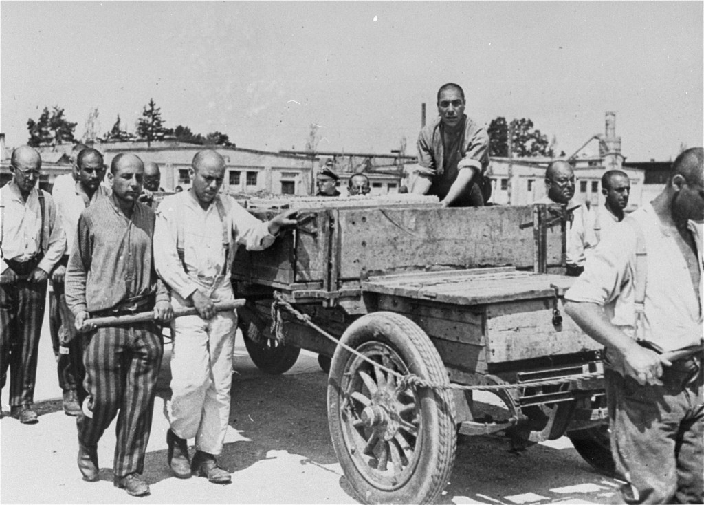 Prisoners at forced labor. Photo taken during an SS inspection. [LCID: 11251a]