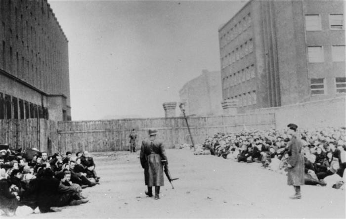 An assembly point (the Umschlagplatz) in the Warsaw ghetto for Jews rounded up for deportation. Warsaw, Poland, 1942–43.