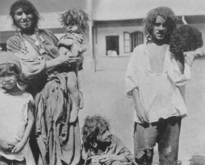 Romani (Gypsy) family near Craiova. Romania, probably 1930s. [LCID: 63359a]