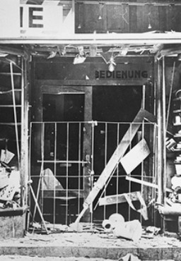 The exterior of a Jewish-owned business damaged by Austrian Nazi terror bombing before the annexation of Austria.
