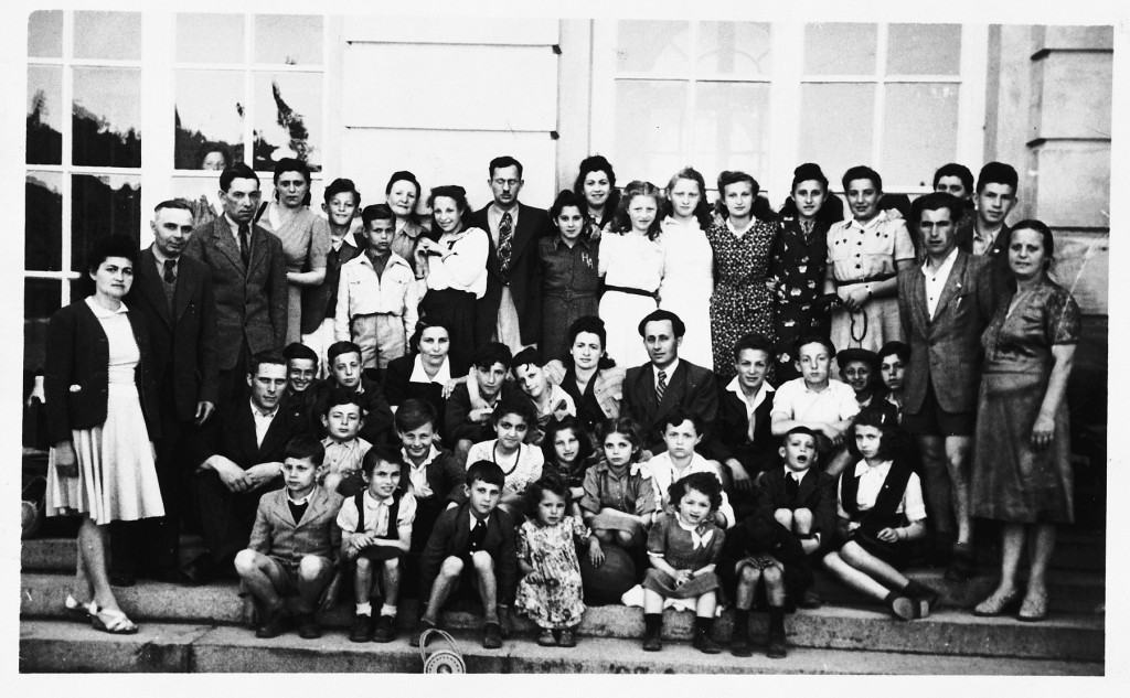 Group portrait of children and adults at the Hebrew school in the Gabersee displaced persons (DP) camp in Germany. Among those pictured is Bronia Spielman (front row, second from the left), circa 1946–1949.