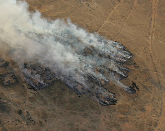 A village burned by the Janjaweed. Photograph taken by Brian Steidle.