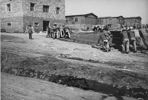 Jewish prisoners at forced labor in the Plaszow camp. [LCID: 03395]