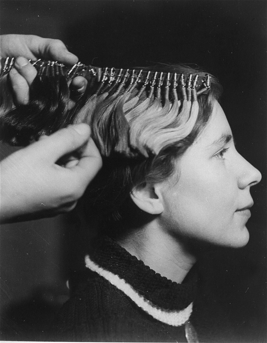 A technician determines the racial make-up of a young woman by the color of her hair