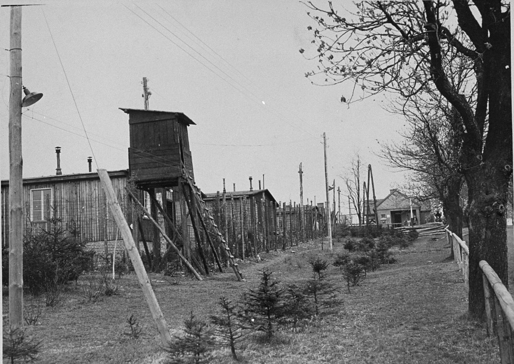 View of a watchtower and prisoner barracks at the Ohrdruf subcamp of the Buchenwald concentration camp, soon after US forces liberated ... [LCID: 85351]