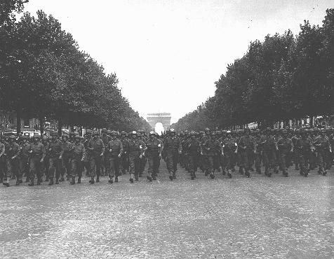 American troops march down the Champs Elysees in Paris following the Allied liberation of the city.