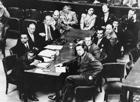 US Brigadier General Telford Taylor (front right), chief of counsel, sits at the prosecution table with his staff during the reading ... [LCID: 07343]