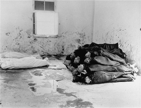 Corpses are piled in the crematorium mortuary in the newly liberated Dachau concentration camp.