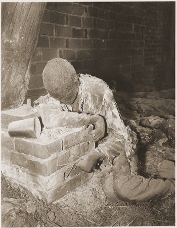 The charred corpse of a prisoner killed by the SS in a barn just outside of Gardelegen.