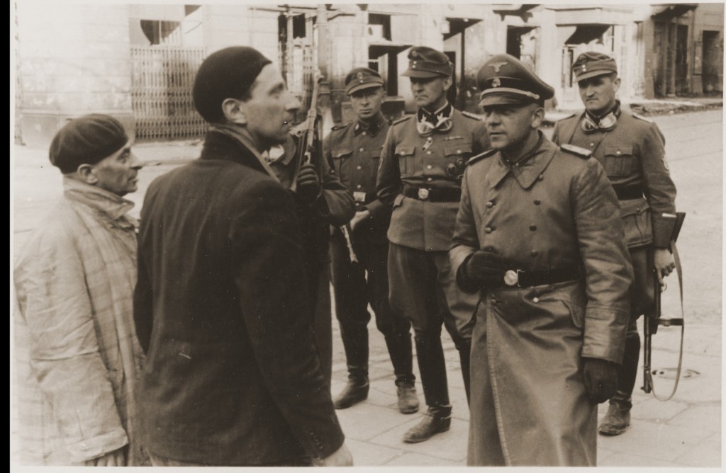 SS and Police Leader Juergen Stroop interrogates two Jews arrested during the Warsaw ghetto uprising. [LCID: 35205]