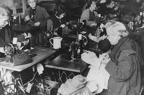 Forced laborers at work in a tailor's workshop. Theresienstadt ghetto, Czechoslovakia, between 1941 and 1945. [LCID: 40229]