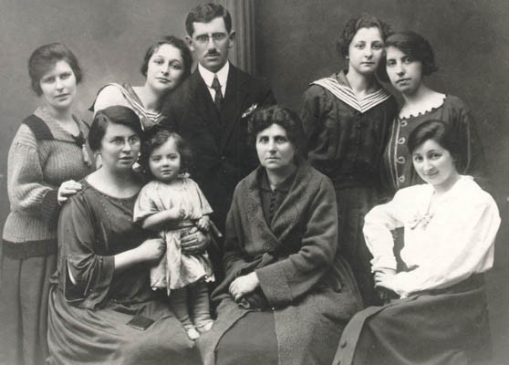 Laks family photo, Poland, ca. 1925. Sitting, left to right:  Pola Laks (Regina's mother) with baby Hania, grandmother Sara Tennenblum, ... [LCID: gelb8]